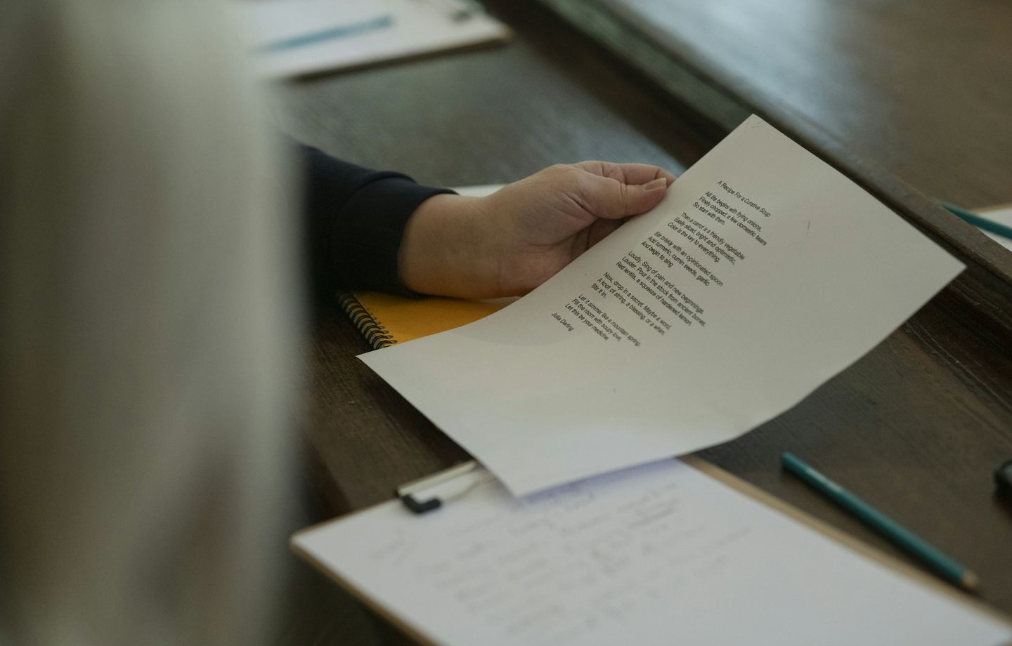 A printed examination paper held over a desk